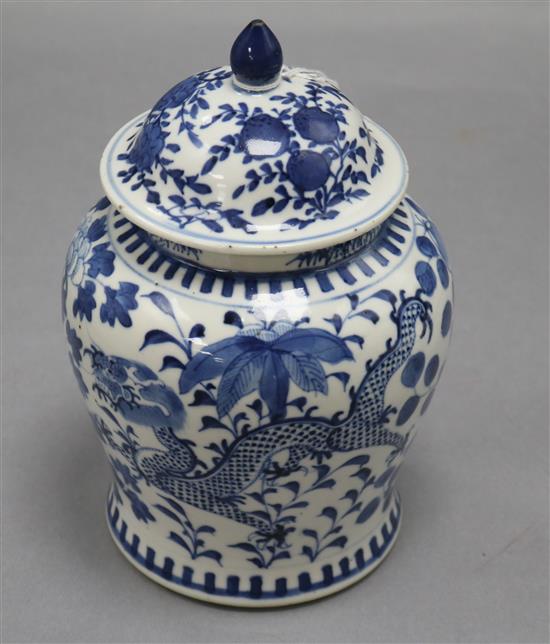 A 19th century Chinese blue and white vase and cover, decorated with dragons height 20cm